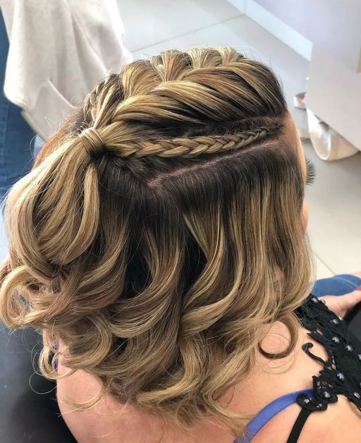 a pretty half updo with a large and two small braids on top an waves down is adorable