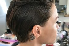 a sleek brunette pixie styled with a braid on top looks very cool and eye-catchy and the braid brings interest to the look