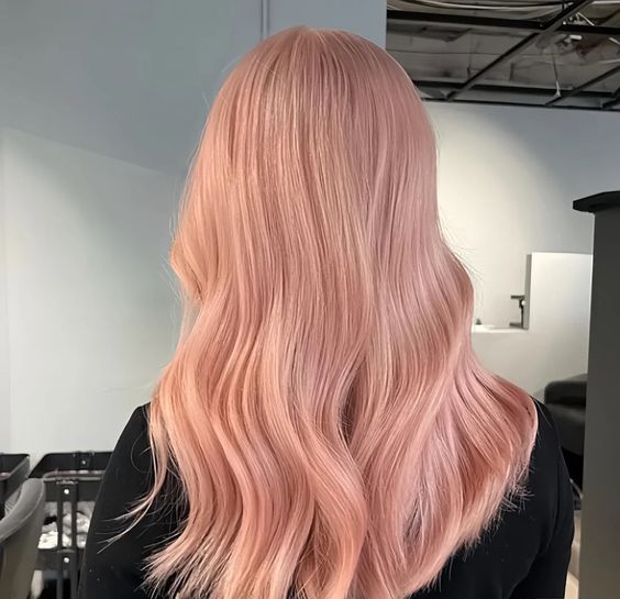 gorgeous long strawberry blonde hair with waves and volume is a stunning idea for spring and summer