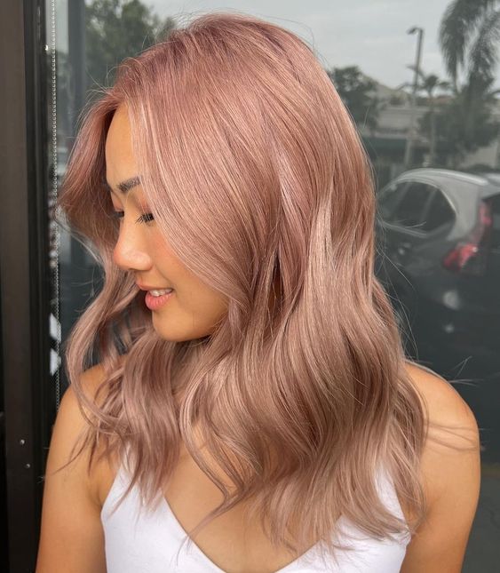 long strawberry blonde hair with waves is a cool idea, and this soft shade will soften your looks too