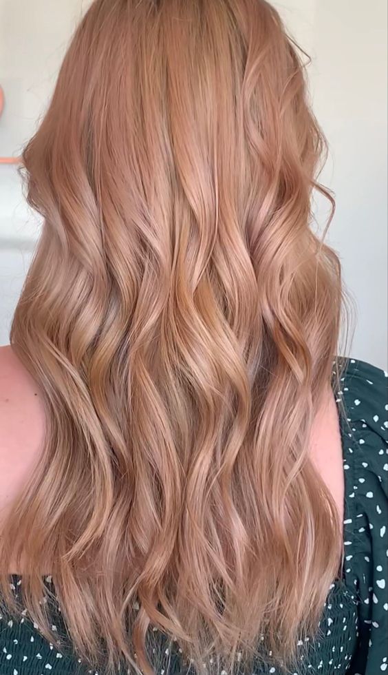 long wavy hair in a soft and warm peachy blonde shade is a cool idea for spring and summer