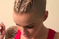 short blonde hair styled with two braids on top and little curly buns at the ends is a creative hairstyle