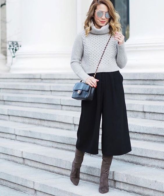 a grey turtleneck sweater, black culottes, taupe suede boots and a black bag for winter