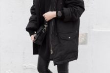 02 an outfit with a black sweater, black leather leggings, white sneakers and a black parka with faux fur