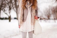 06 a white lace dress and white tights, a grey leather jacket, a furry vest, grey boots and a white bag