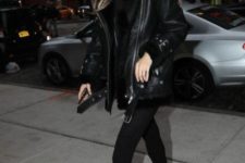 07 a total black look by Gigi Hadid with skinnies, combat boots, a sweater and a shearling coat