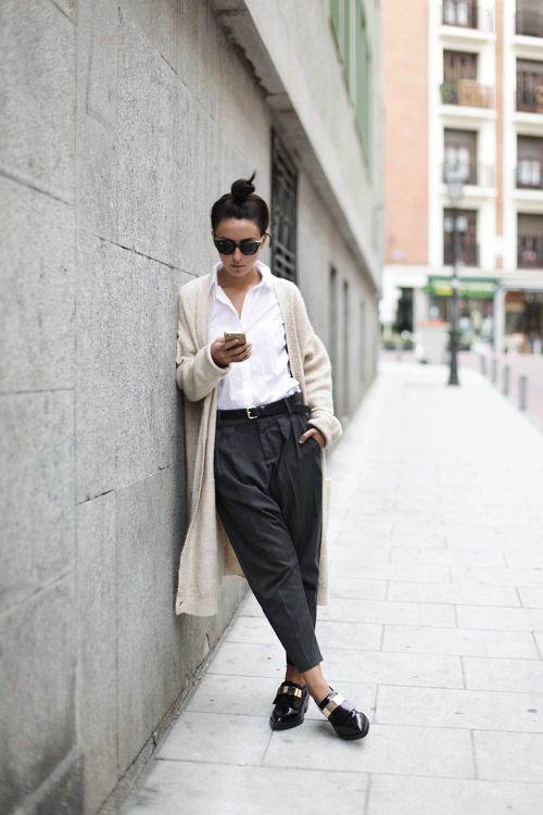a white shirt, grey cropped pants, black flat shoes and a creamy cardigan for a minimalist look
