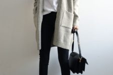 11 a white tee, black cropped pants, an off-white long cardigan, black flat shoes and a black bag