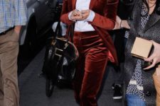 12 a burgundy velvet pantsuit, a white shirt, printed shoes for a statement look