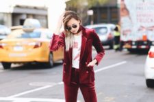 13 a burgundy velvet suit with cropped pants, a printed tee, a choker and white sneakers for a bold statement