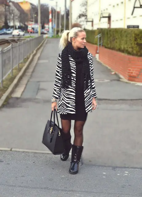 With black dress, high boots, black scarf and tote
