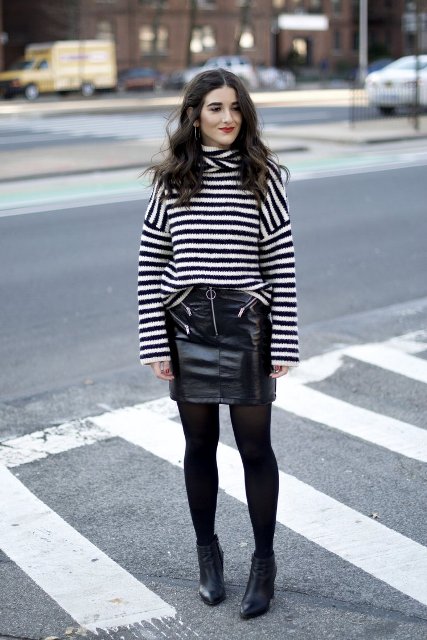 With black leather mini skirt, black tights and ankle boots