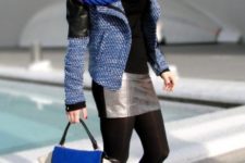 With black shirt, mini skirt, black tights, embellished boots, tweed and leather jacket and tote