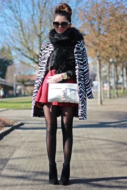 With black shirt, red skirt, white bag and high heeled boots