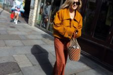 With brown jacket and orange pants