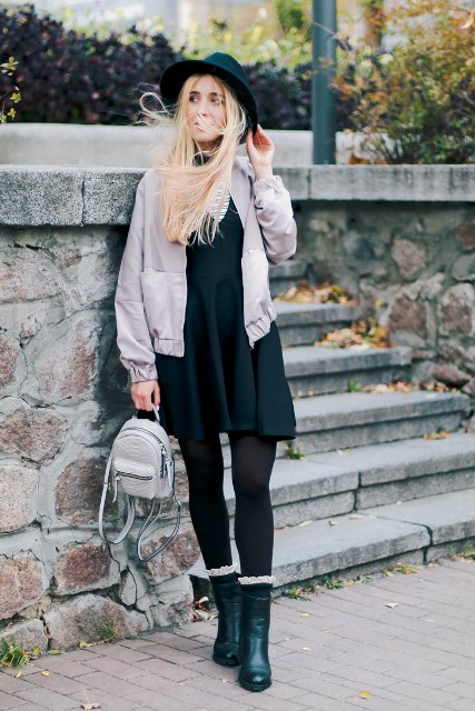 With dress, black tights, emerald boots, black hat and pastel colored jacket