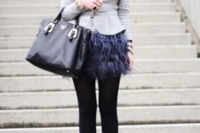 With gray jacket, hat, black tights, platform shoes and black tote