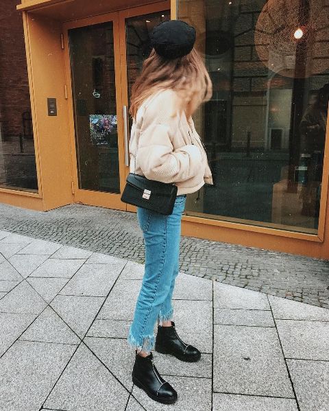 With jeans, black flat boots, chain strap bag and hat