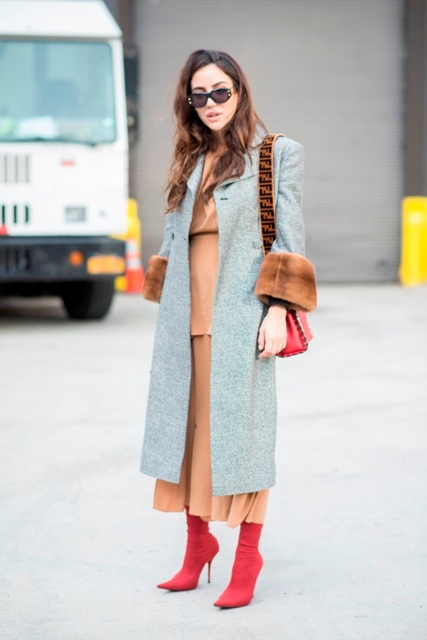 With light brown maxi dress, red sock boots and red bag