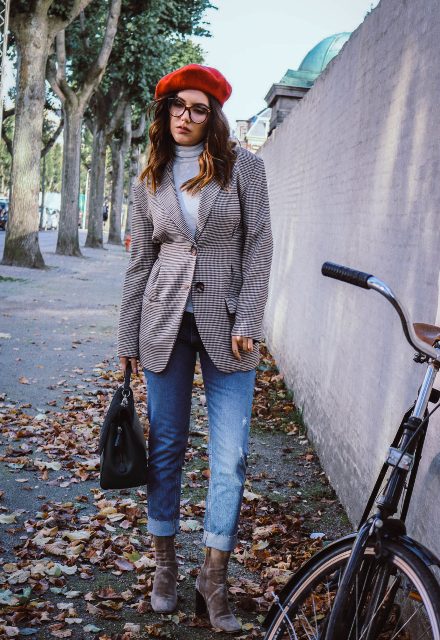 With light gray turtleneck, printed blazer, cuffed jeans, black bag and velvet boots