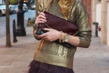 With metallic sweater and marsala clutch