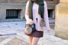 With mini skirt, pale pink jacket, chain strap bag and pumps