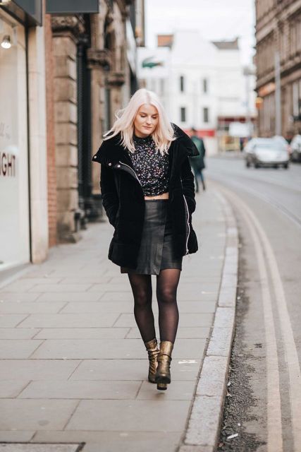 With printed shirt, black leather skirt and metallic boots