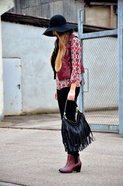 With printed shirt, marsala vest, wide brim hat, black trousers and marsala leather ankle boots