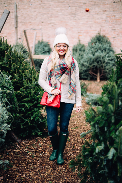 With sweater, plaid scarf, red bag, jeans and green high boots