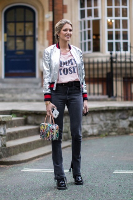 With t-shirt, flare jeans, black leather boots and printed bag