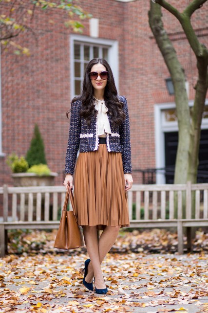 With white blouse, brown pleated skirt, navy blue shoes and brown bag