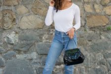 With white shirt, classic jeans and black and white shoes