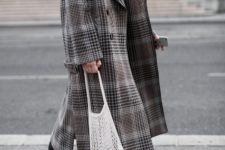 With white t-shirt, black trousers, beige heels and checked maxi coat
