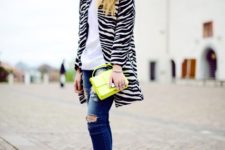 With white t-shirt, distressed jeans, high heels and yellow bag
