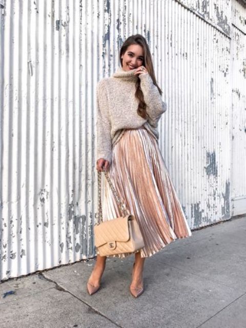 a neutral oversized sweater, a blush pleated midi skirt, blush heels and a neutral bag