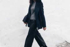 black cropped leather pants, a grey sweater, a navy short coat, black booties and a bag
