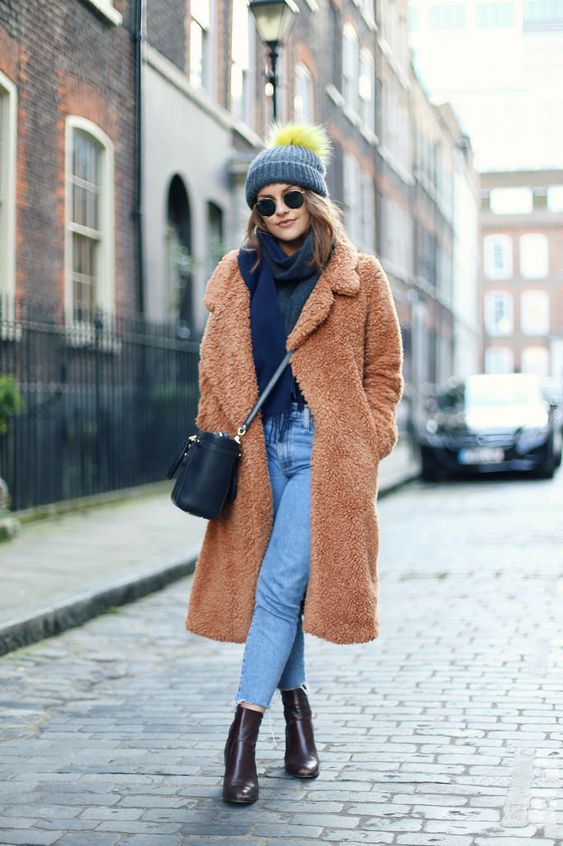 blue cropped jeans, a navy scarf, burgundy boots, a camel teddy bear coat and a beanie