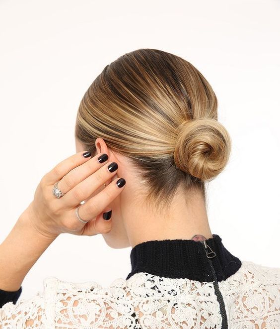 a sleek low bun with a sleek top always works and matches many kinds of outfits