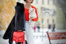 05 an orange sweater, a white and black pleated skirt, a black fur coat, black boots and a coral bag
