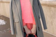 08 a grey coat, a coral shirt and a sweater over it, black jeans and a red bag for a stylish winter look