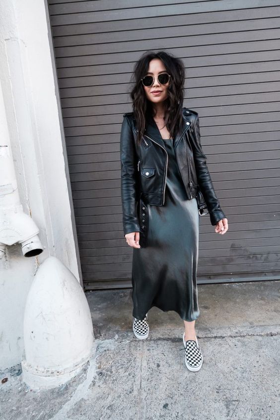 a slip silk midi dress, a black leather jacket and checked slipons for a grunge feel