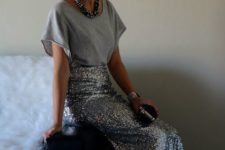 09 a grey tee, a silver maxi skirt, a statement necklace and a velvet clutch for a simple festive outfit