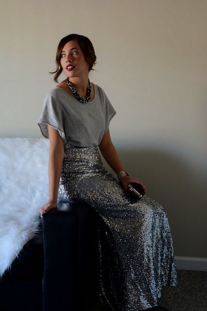 a grey tee, a silver maxi skirt, a statement necklace and a velvet clutch for a simple festive outfit