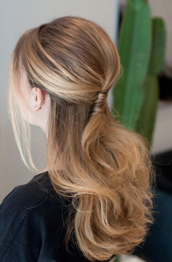 a half updo with a twisted element and wavy hair plus bangs will look romantic yet office appropriate
