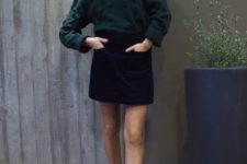 11 a navy velvet mini skirt with pockets, a forest green sweater, white sneakers for a casual look