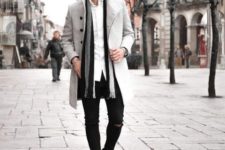 White button down shirt, striped scarf, gray coat, black boots and distressed pants