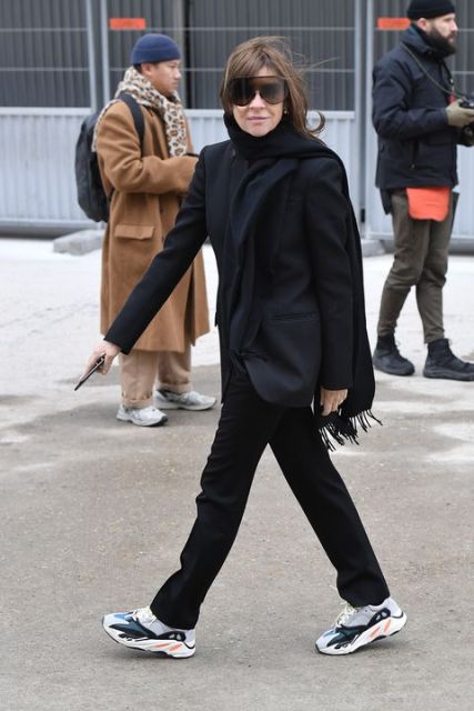With black blazer, scarf and straight trousers