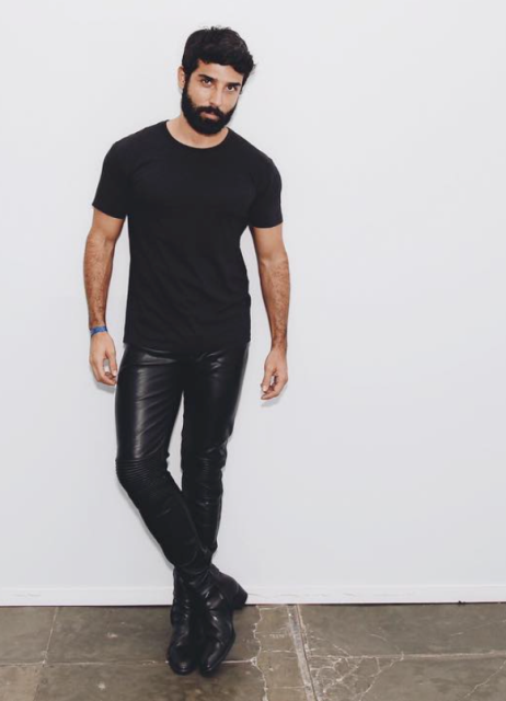 With black t-shirt and black leather boots