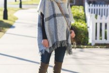With black wide brim hat, jeans, crossbody bag and gray boots