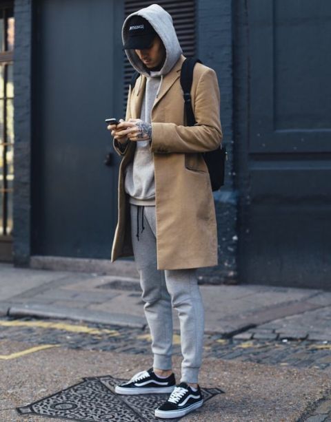 cool men's winter outfit with a baseball cap